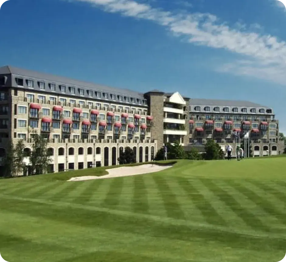 A resort hotel overlooking a manicured golf fairway